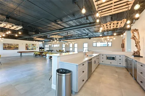 a kitchen with a stove and a refrigerator