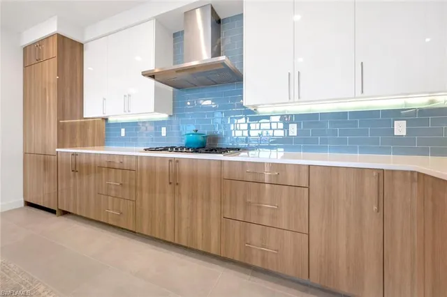 a kitchen with stainless steel appliances granite countertop a sink and cabinets