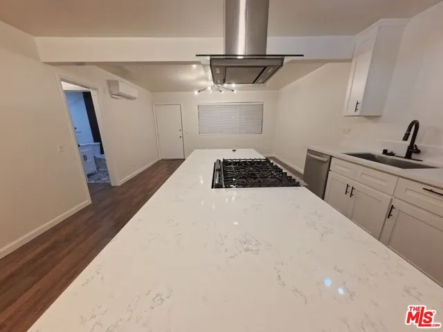 a bedroom with a bed and a stove