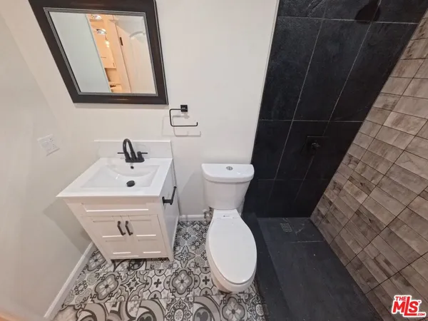 a bathroom with a toilet and a sink