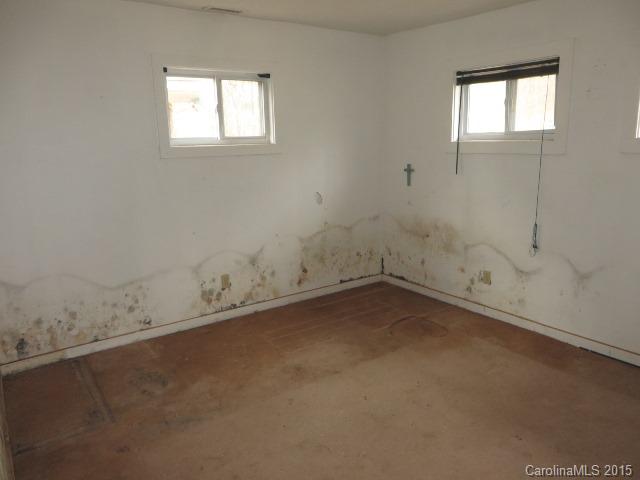 3911 Robinson Road Newton, NC 28658 - Photo 7 of 12 an empty room with a window