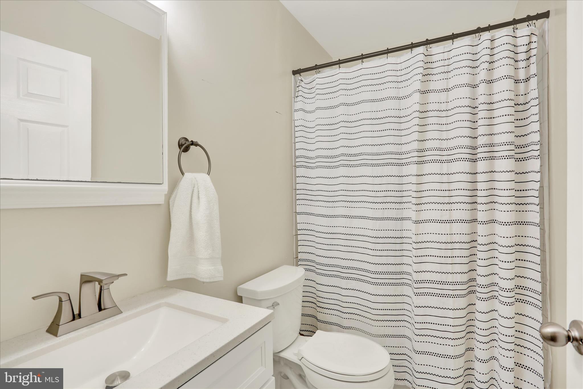 203 Pembroke Drive Shillington, PA 19607 - Photo 19 of 41 a bathroom with a sink a toilet and shower curtain