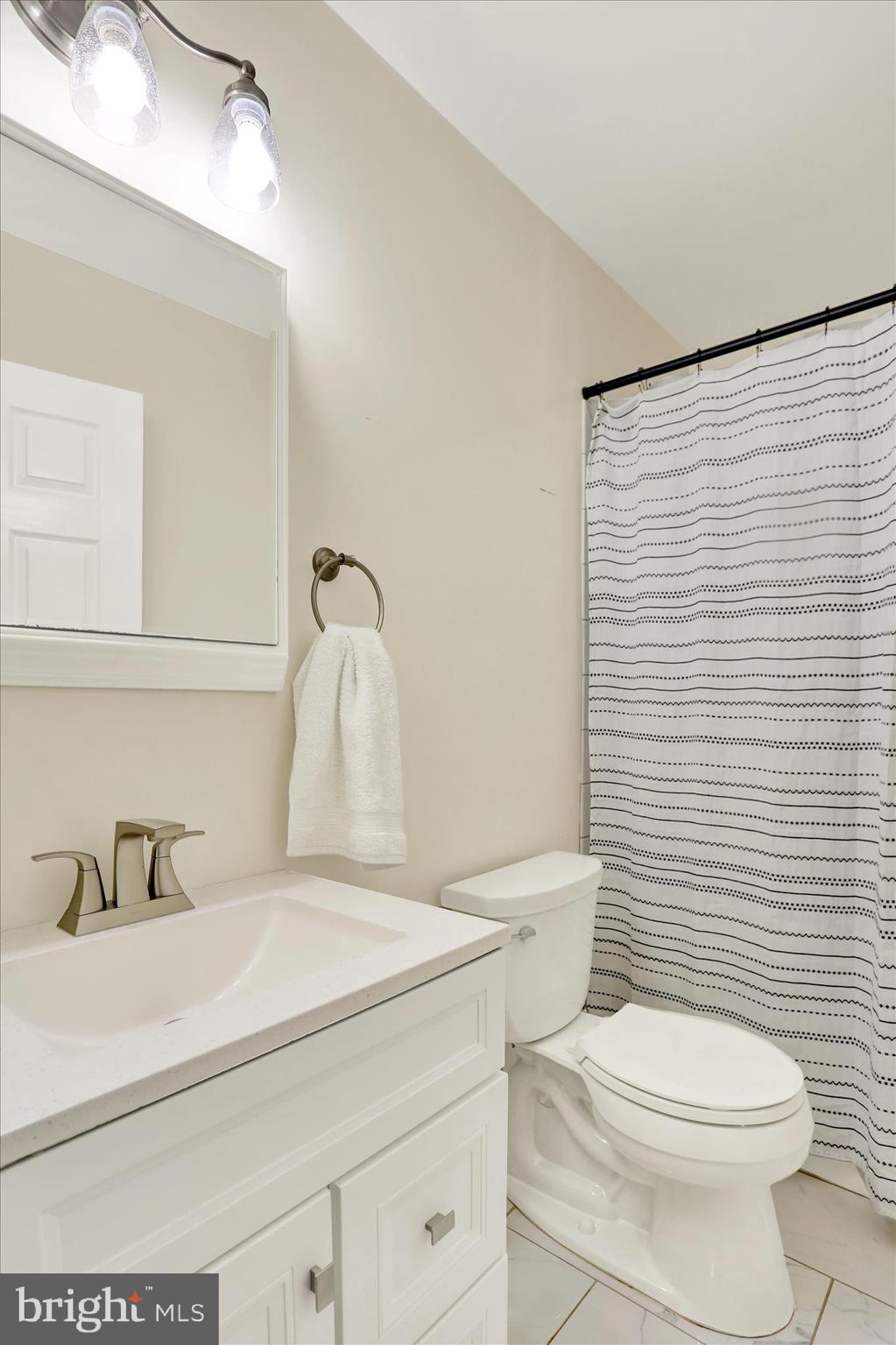 203 Pembroke Drive Shillington, PA 19607 - Photo 20 of 41 a bathroom with a sink a toilet and mirror