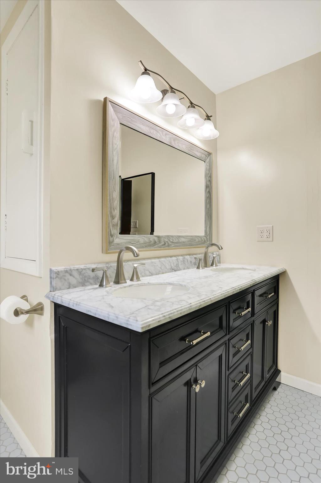 203 Pembroke Drive Shillington, PA 19607 - Photo 24 of 41 a bathroom with a double vanity sink and a mirror