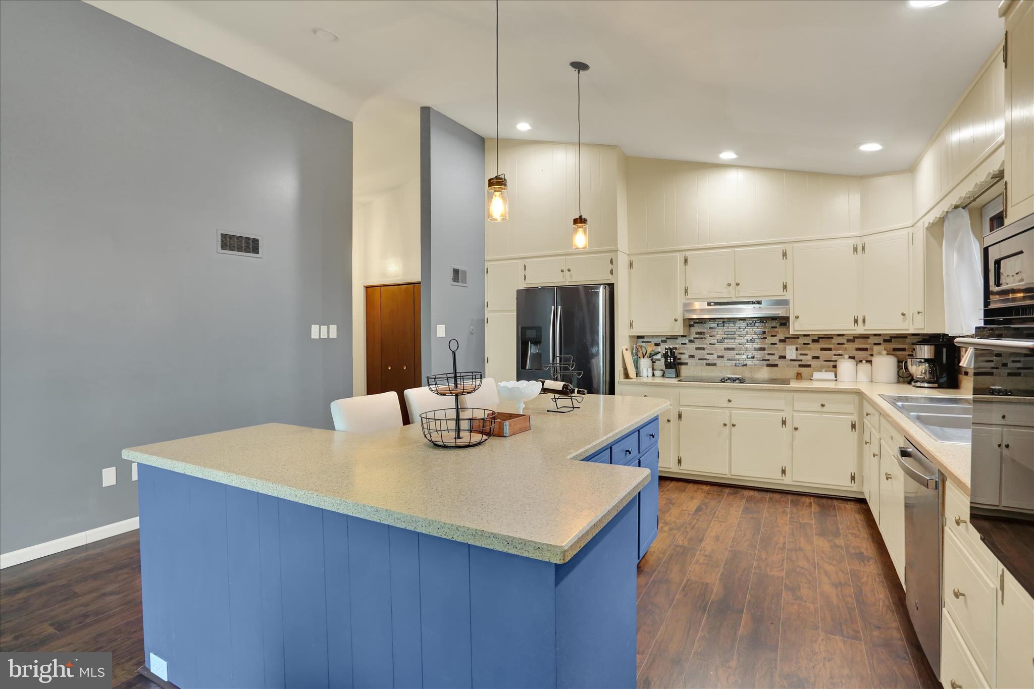 203 Pembroke Drive Shillington, PA 19607 - Photo 9 of 41 a kitchen with stainless steel appliances kitchen island granite countertop a sink a stove and white cabinets