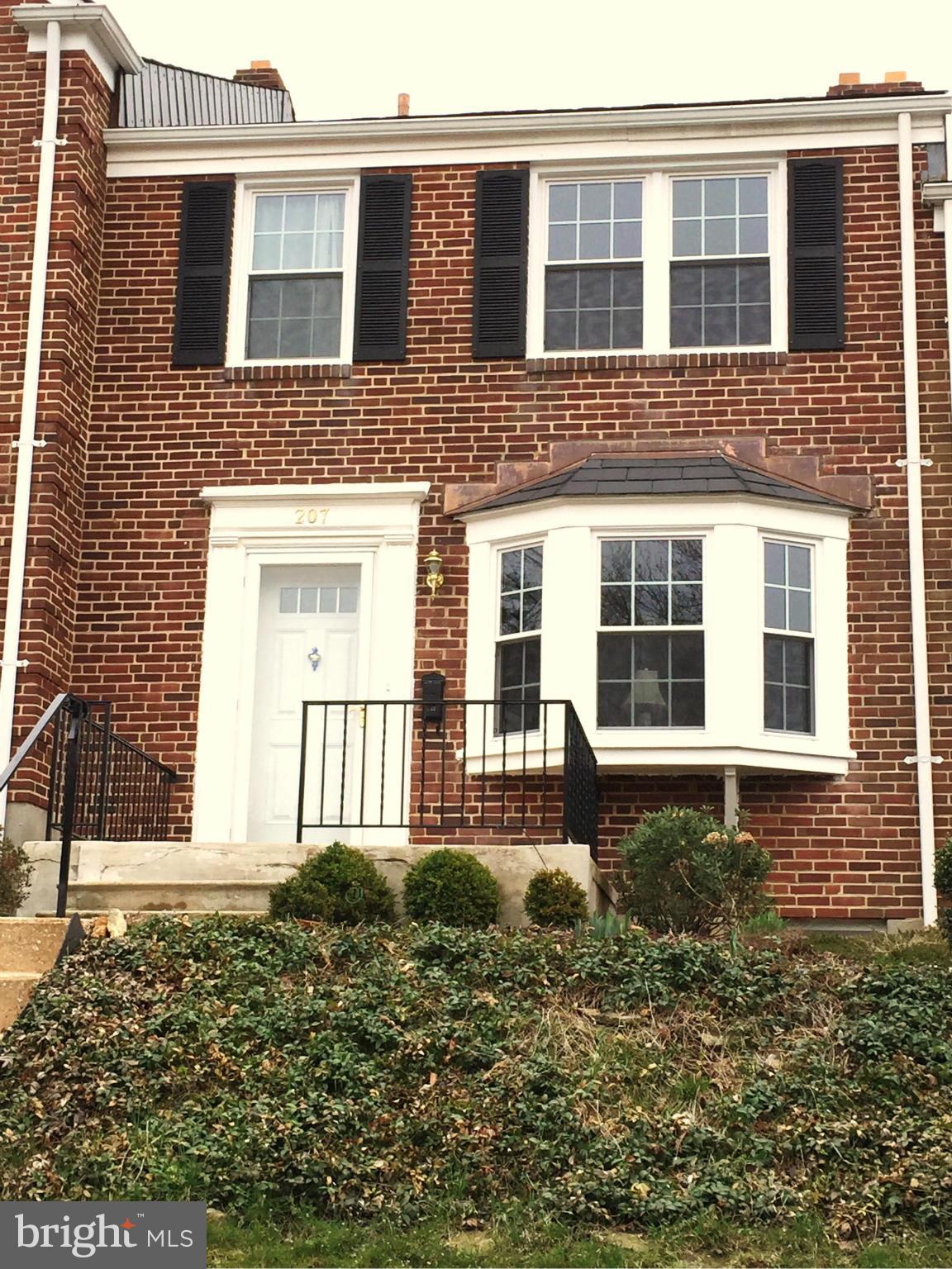 207 Stanmore Road Baltimore, MD 21212 - Photo 1 of 7 a front view of a house with a yard