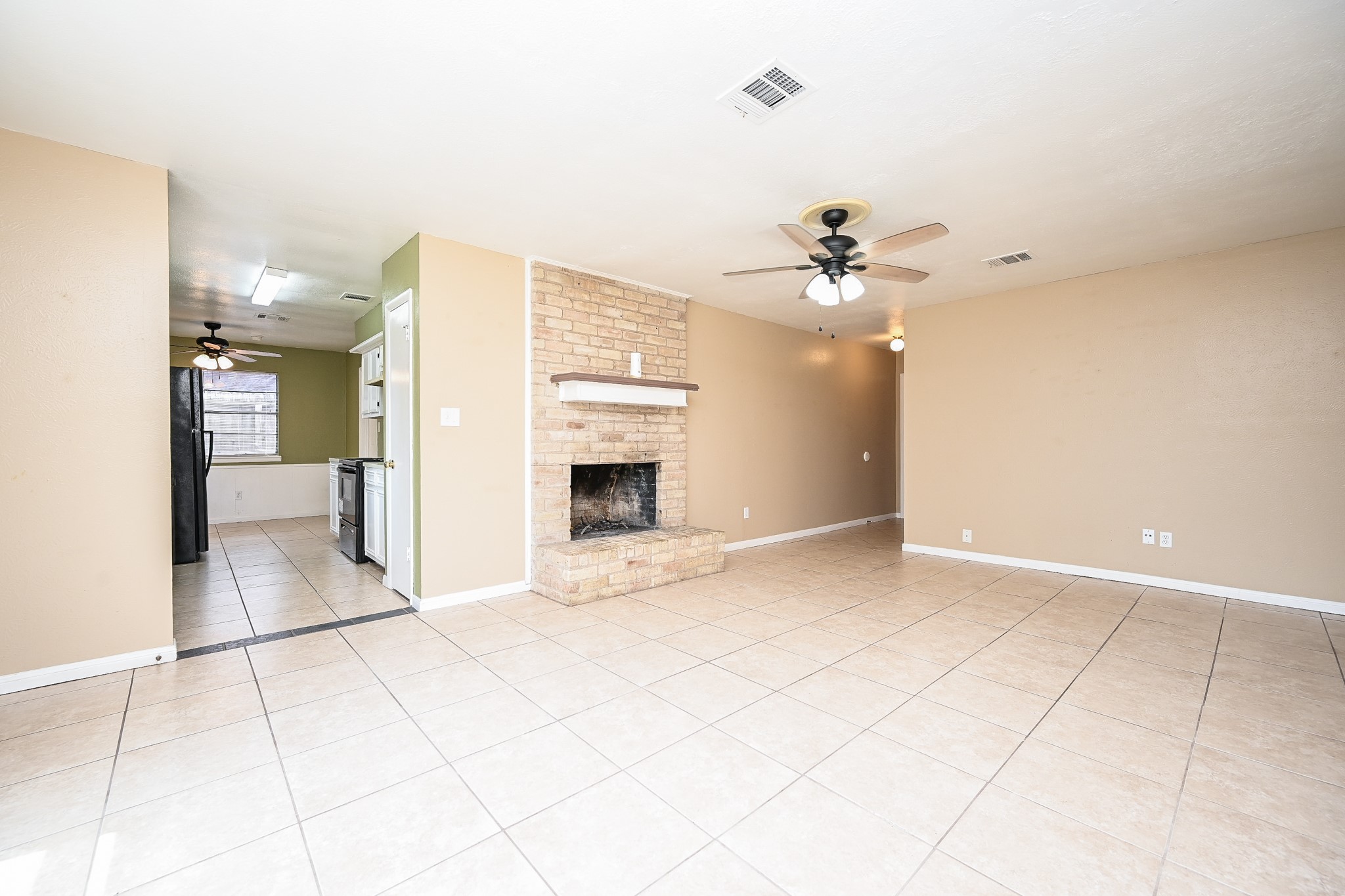 6634 Bridgegate Drive Spring, TX 77373 - Photo 5 of 16 a view of an empty room with a fireplace