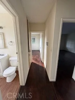 a view of a bathroom from a hallway