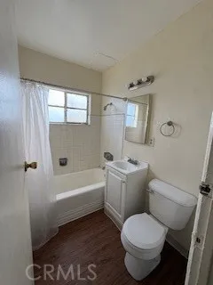 a bathroom with a toilet sink and bathtub