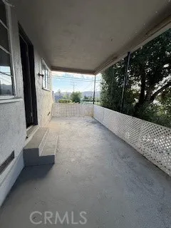 a view of a couches in the balcony