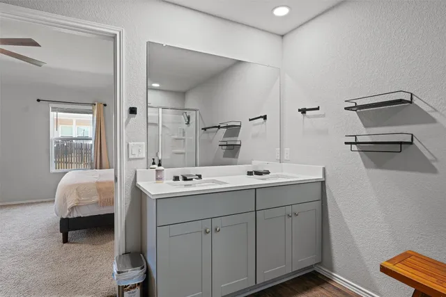 a bedroom with a bed and a chair