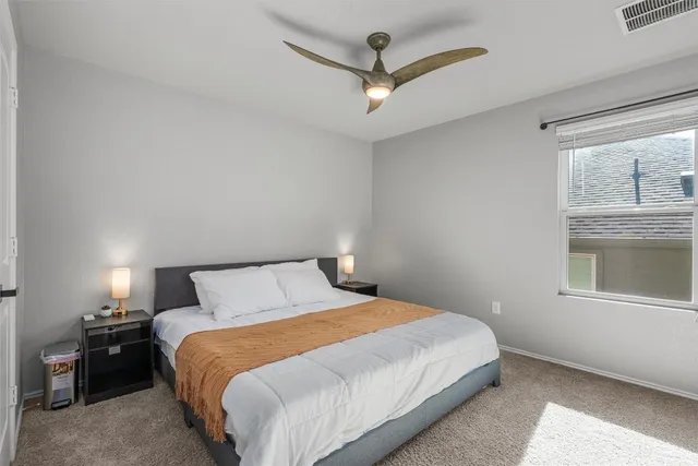 a room with a bench and wooden floor