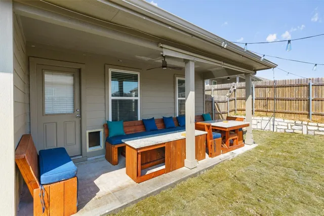 a bathroom with a sink a toilet a mirror and shower curtain