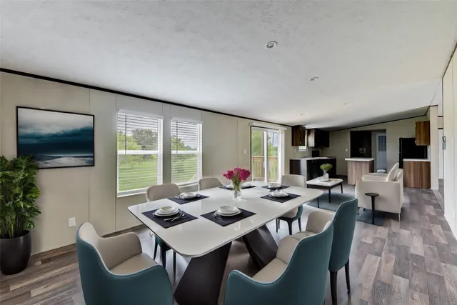a view of a dining room with furniture window and outside view