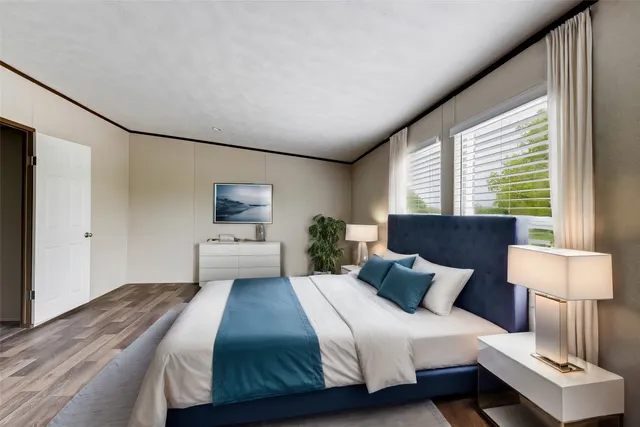 a bedroom with bed and window