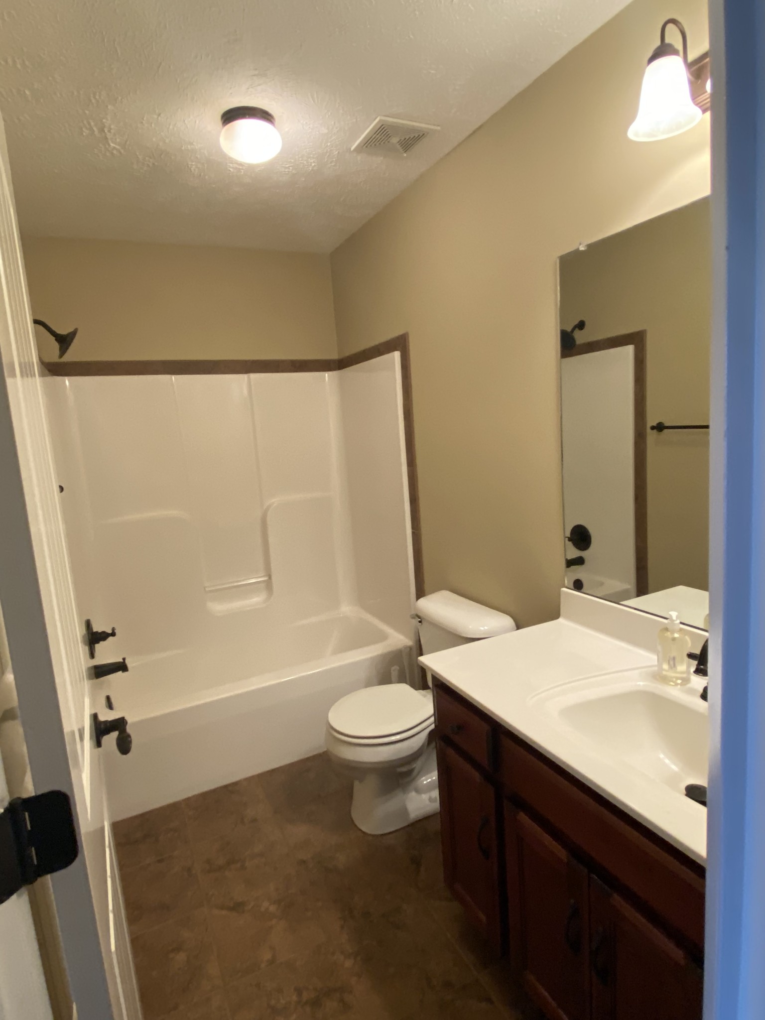 3732 Suiter Road Clarksville, TN 37040 - Photo 12 of 14 a bathroom with a sink a toilet and shower