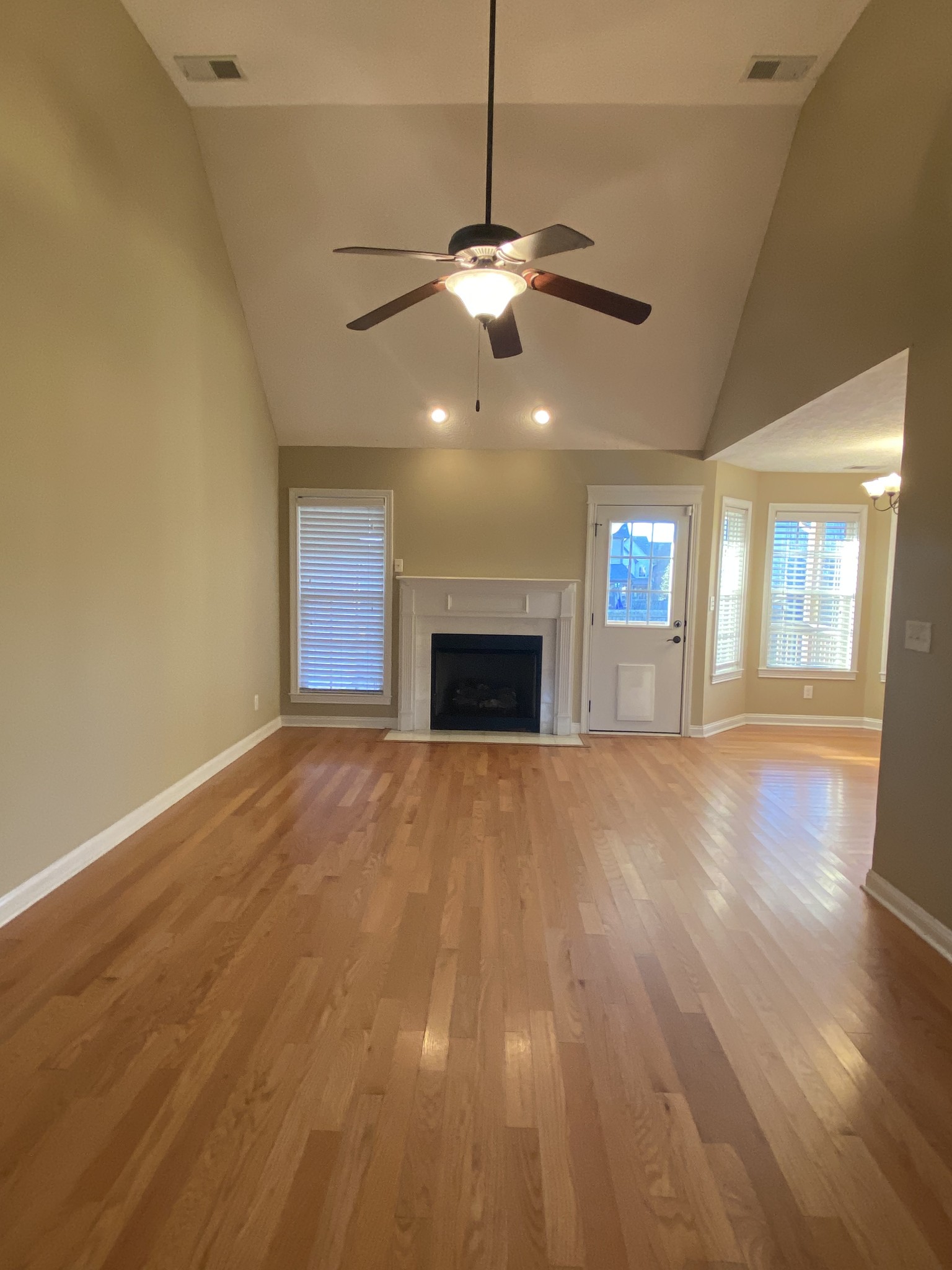 3732 Suiter Road Clarksville, TN 37040 - Photo 3 of 14 an empty room with windows and fireplace