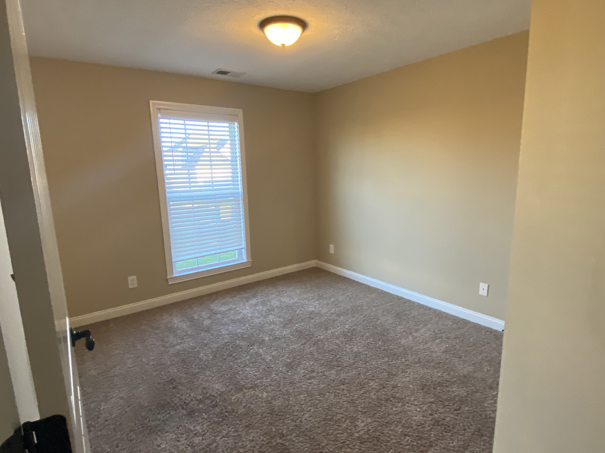 3732 Suiter Road Clarksville, TN 37040 - Photo 9 of 14 an empty room with windows