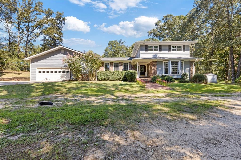 990 Academy Church Road Jefferson, GA 30549 - Photo 1 of 1 a front view of a house with a yard