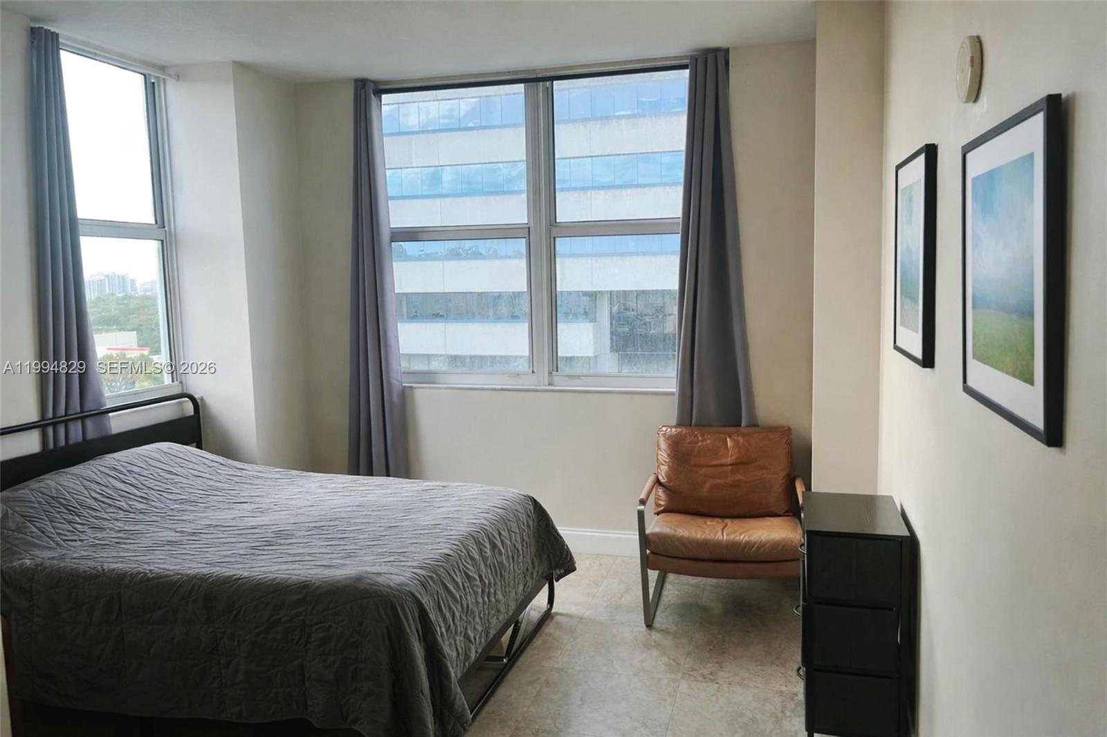 3180 Southwest 22nd Terrace, Unit 607 Miami, FL 33145 - Photo 11 of 18 a bedroom with a bed and a window