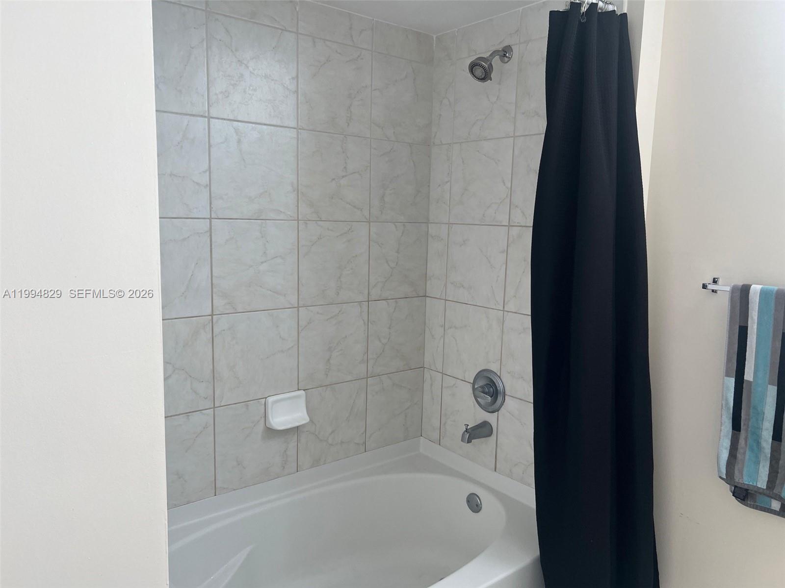 3180 Southwest 22nd Terrace, Unit 607 Miami, FL 33145 - Photo 14 of 18 a bathroom with a bathtub