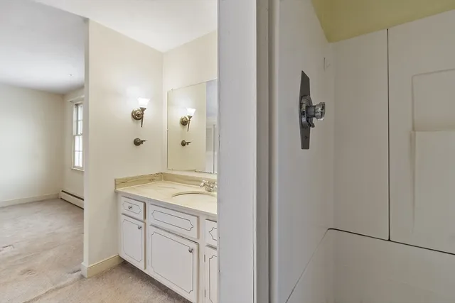 a bathroom with a granite countertop sink a mirror and a
