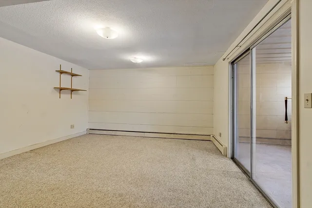 an empty room with closet area