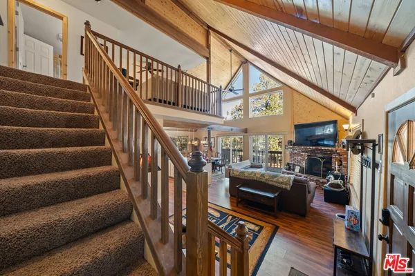 a living room with lots of furniture and a flat screen tv