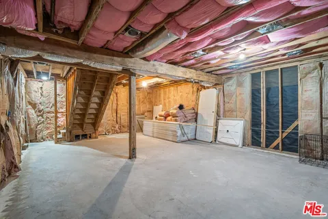 a picture of a room with a small kitchen