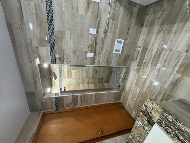 875 GreenView Court, Unit 62 Rochester, MI 48307 - Photo 13 of 19 Walk-in shower with glass enclosure and mosaic tile accents