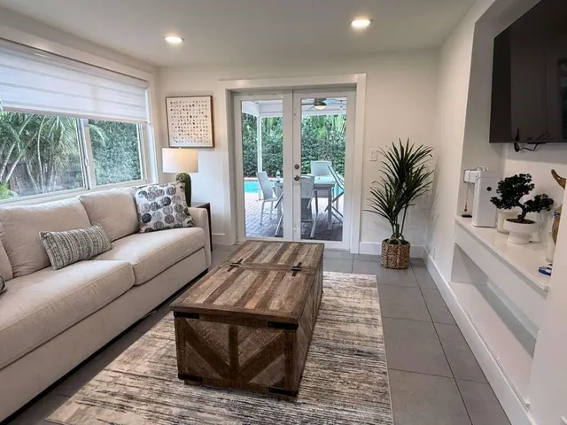 a living room with furniture and a fireplace
