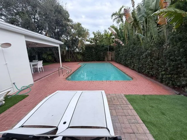 a backyard of a house with lots of green space