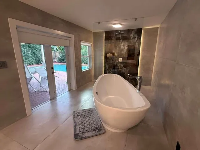 a bathroom with a bathtub toilet and sink