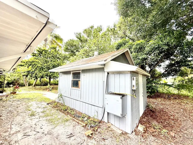 a bathroom with a large window and a bathtub