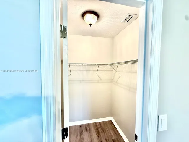 a view of a kitchen with furniture and a window