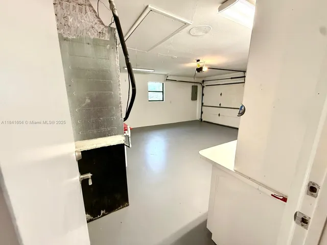 a view of an empty room with a large window