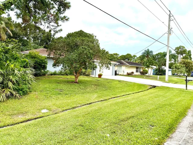a view of a living room with a wooden floor