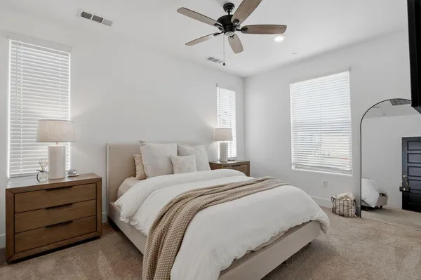a bedroom with a bed and a window