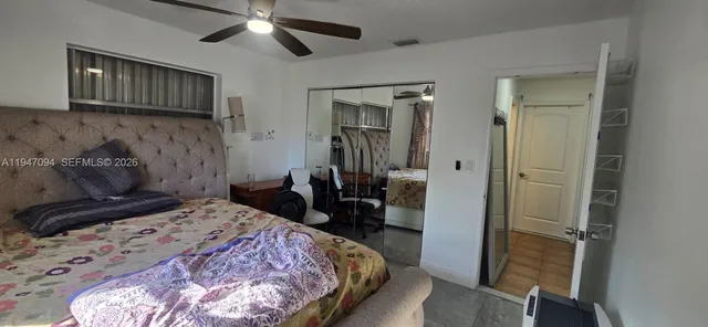 a bedroom with a bed and a walk in closet