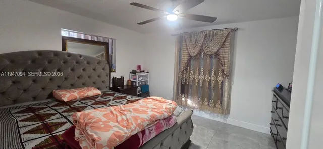 a bedroom with a bed and a walk in closet