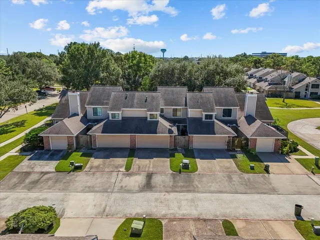 a view of a patio with couches table and chairs and potted plants