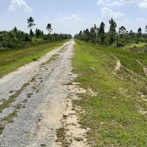 a view of a lake with houses in the back