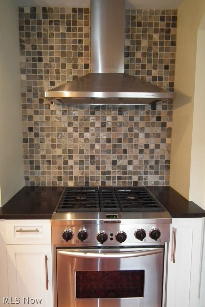 2671 Rochester Road Shaker Heights, OH 44122 - Photo 3 of 22 High end stove with commercial hood and beautiful tile background