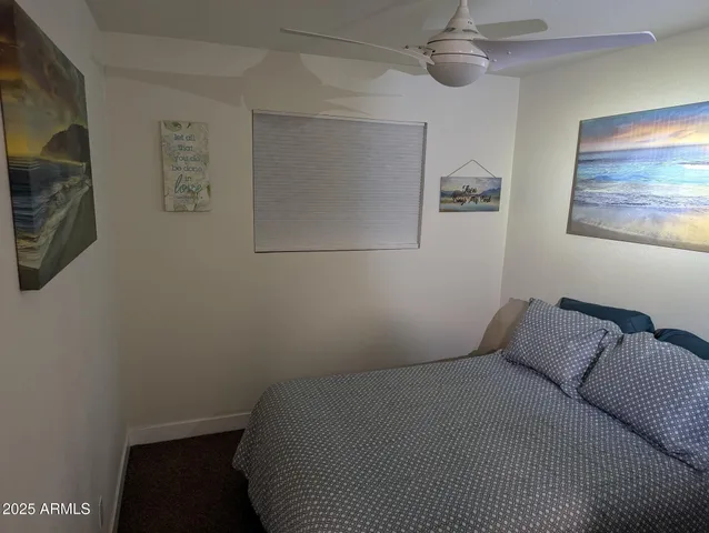 a bathroom with a toilet a sink and a mirror