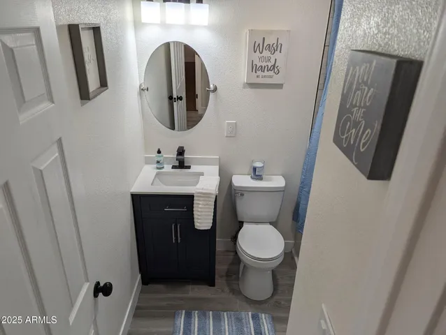 a bedroom with a bed and wall painting