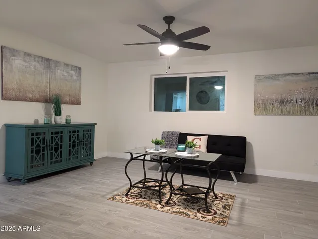 a view of a dining room with furniture and wooden floor