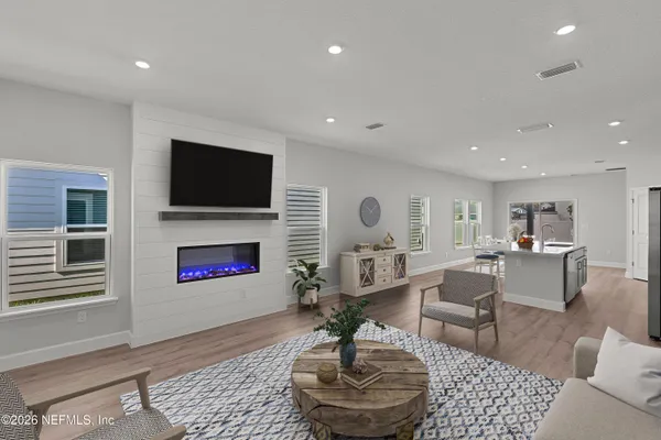 a living room with fireplace furniture and a flat screen tv