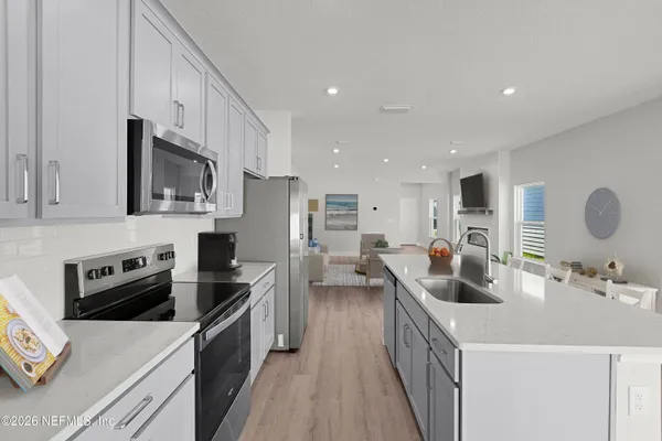a kitchen with counter top space stainless steel appliances and cabinets