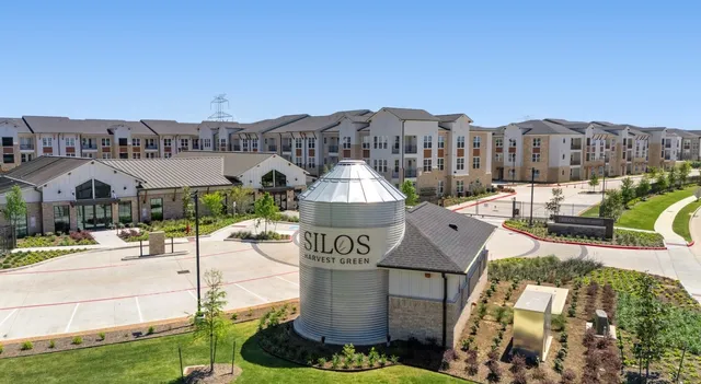 a front view of a building with garden