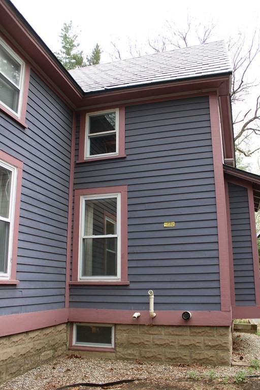 550 Bridge Road Northampton, MA 01062 - Photo 20 of 23 a front view of a house with a yard